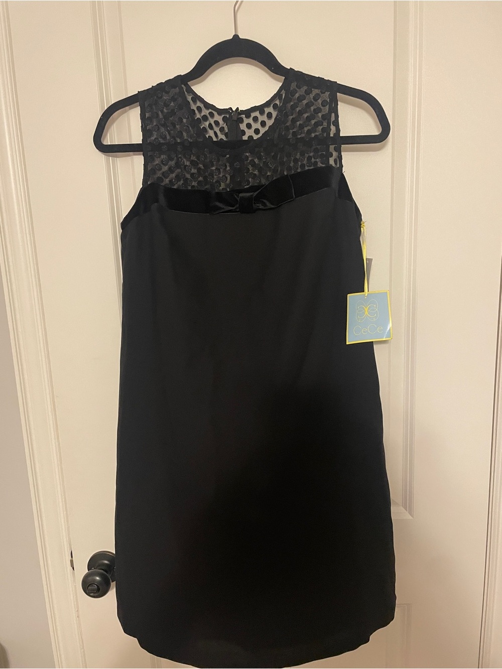 CeCe Black Sleeveless Sheath Dress with Polka Dot Mesh Yoke and Velvet Bow